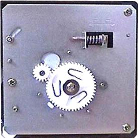 The motor and ejector gears on a component style ice maker